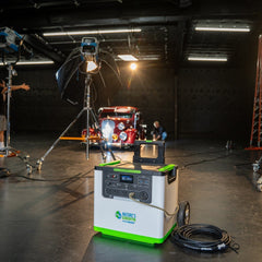 Portable power station with green and white design in a studio setting with filming equipment. Nature's Generator L3600 3600W portable power station
