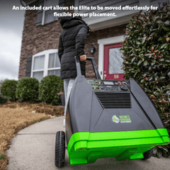 Person pushing a natures genertor elite green and gray power tool on a sidewalk with text about an included cart.