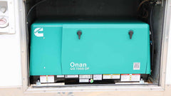 QG 7000 RV generator installed in motorhome compartment

